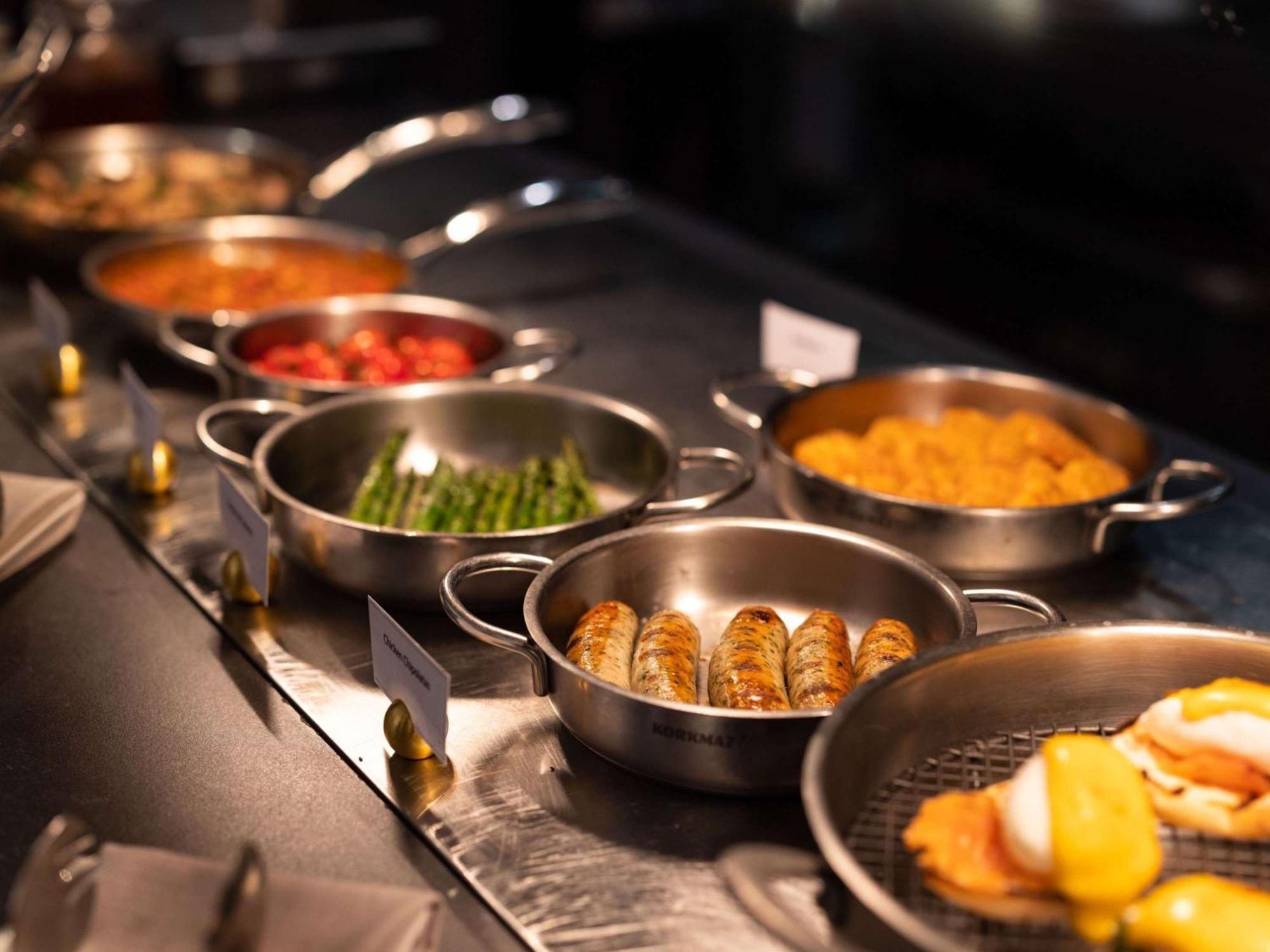 The Playford Adelaide - Mgallery Exterior photo A selection of prepared foods at a buffet