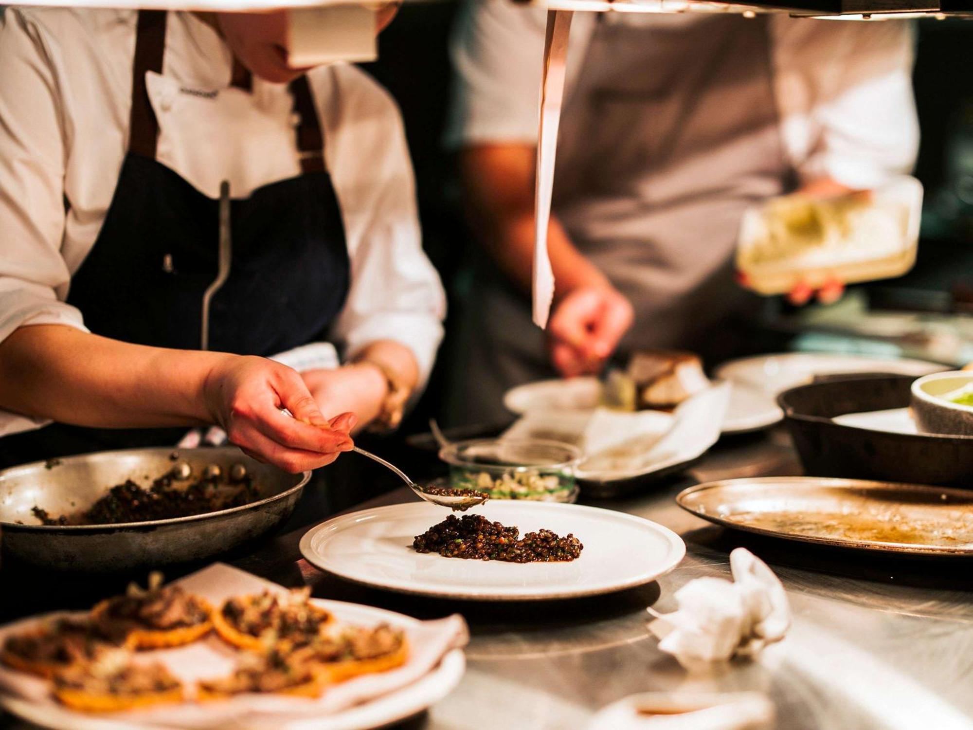 The Playford Adelaide - Mgallery Exterior photo A chef plating a dish
